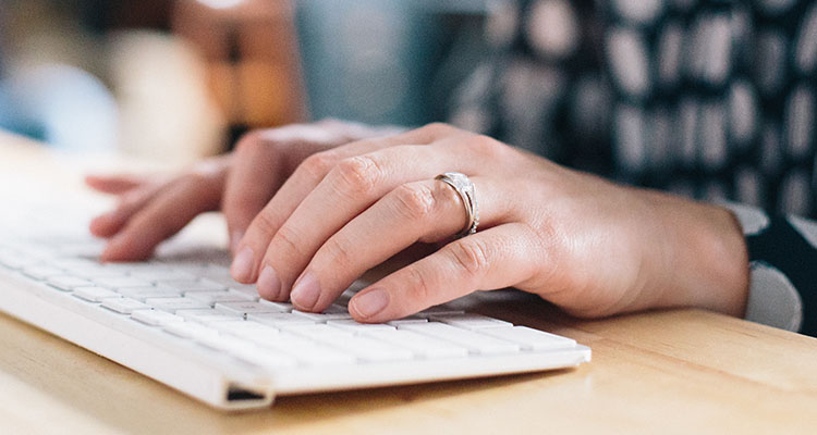 woman typing on computer